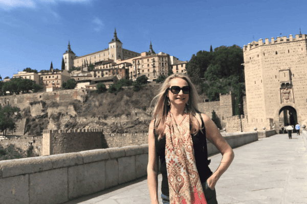 Kim, The Abundant Traveler, in summer; summer packing list; summer travel guide