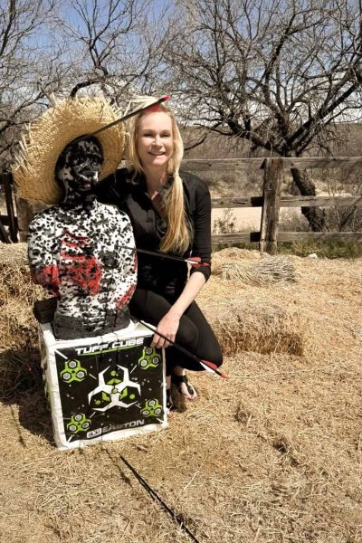 Kim with her archery target results at Tombstone Monument Ranch, an Arizona Dude Ranch