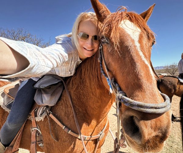 Kim, The Abundant Traveler, on her riding horse, Buddy, at Tombstone Monument Ranch, an Arizona Dude Ranch