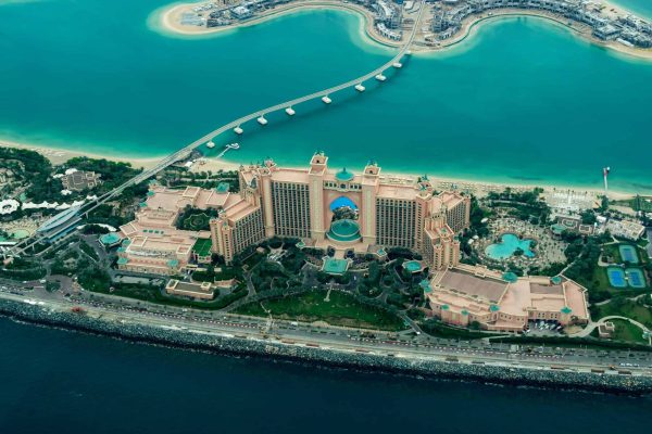 Tips for exploring Dubai on a budget - image of luxury Dubai hotel on the water